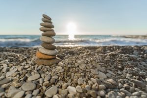 Stack of Pebbles Balanced on a Rocky shore